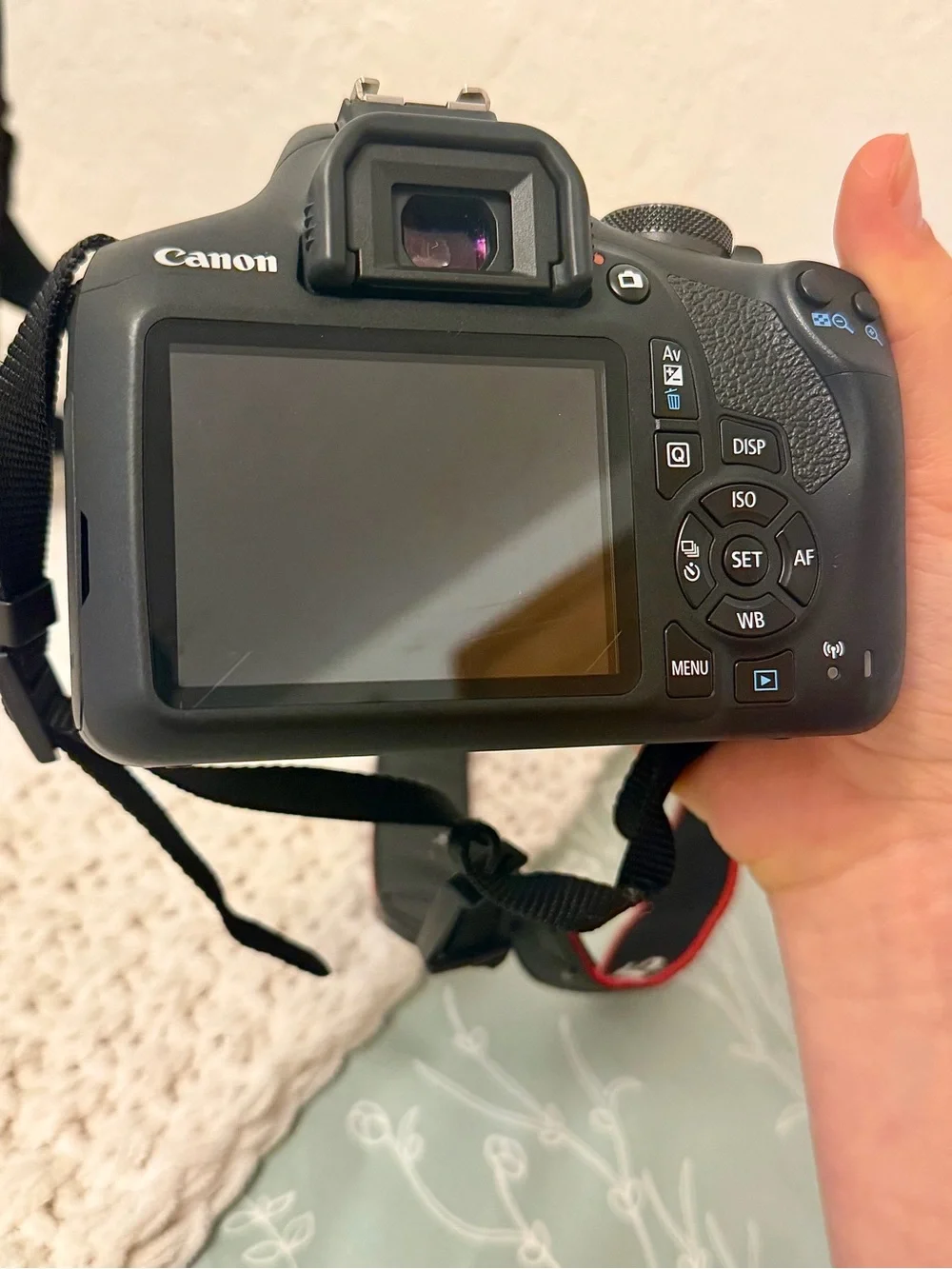 Canon DSLR Camera with Zoom Lens and Black Carrying Bag